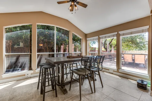 a view of a dining room with furniture window and outside view