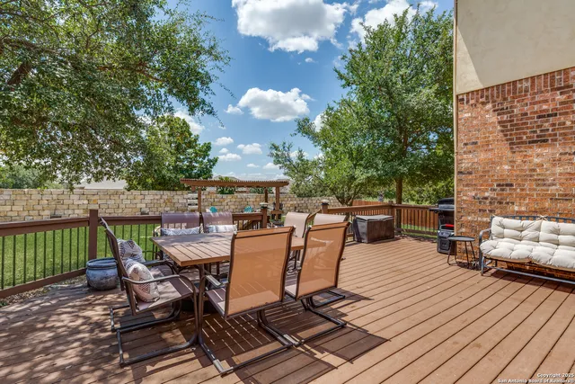 a view of a patio with wooden floor