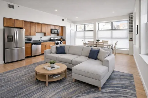 a living room with furniture and a table