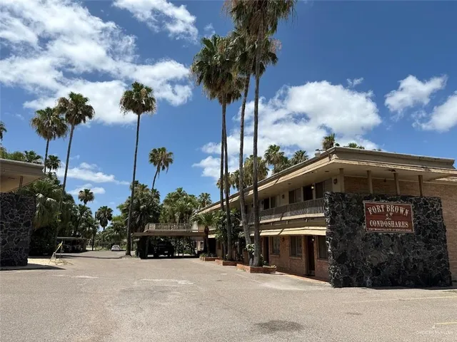 a front view of a building with garden