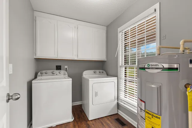 a view of storage and utility room with washer and dryer