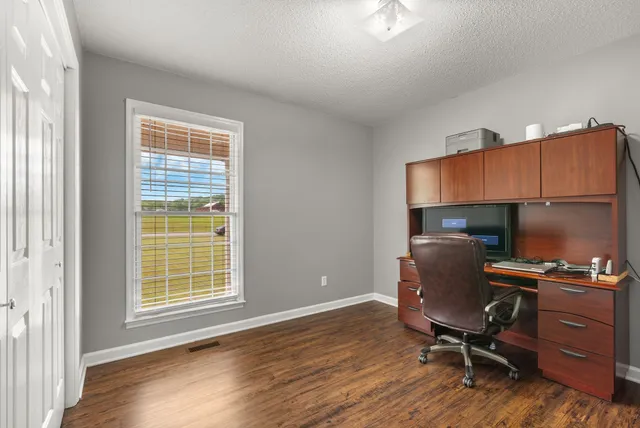 a workspace with furniture and a window