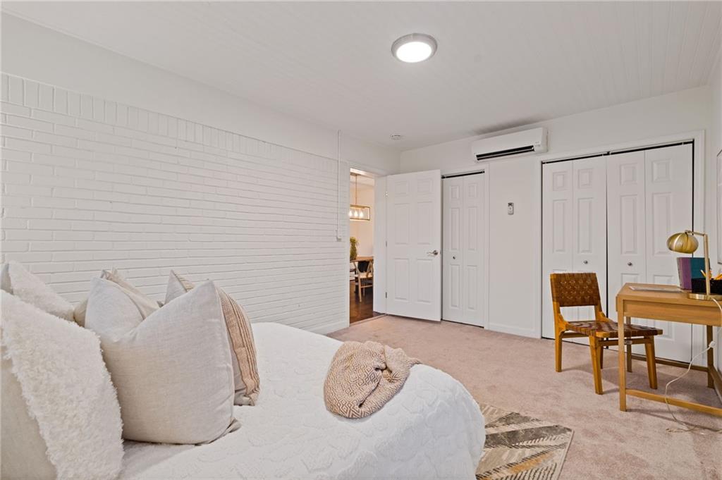 2226 Alpha Drive Decatur, GA 30032 - Photo 24 of 36 a bedroom with furniture and a chair