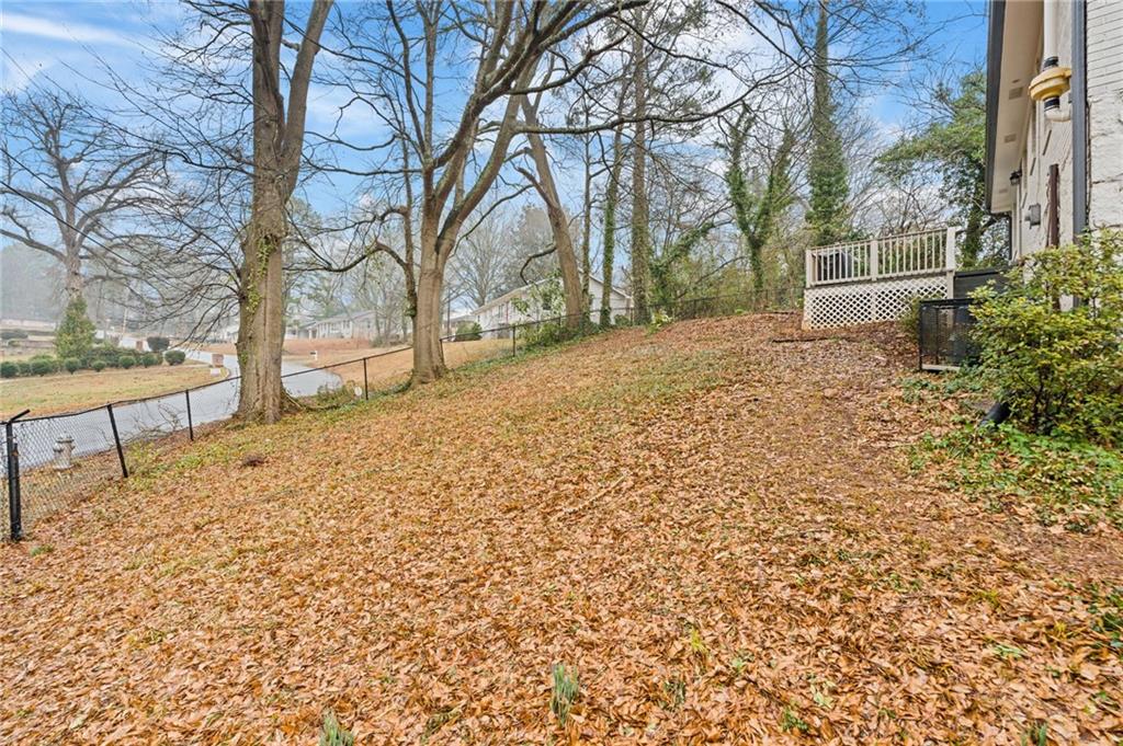 2226 Alpha Drive Decatur, GA 30032 - Photo 31 of 36 a wooden bench sitting in middle of a yard