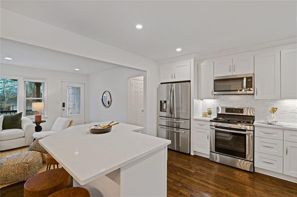 2226 Alpha Drive Decatur, GA 30032 - Photo 6 of 36 a kitchen with stainless steel appliances a stove microwave and refrigerator