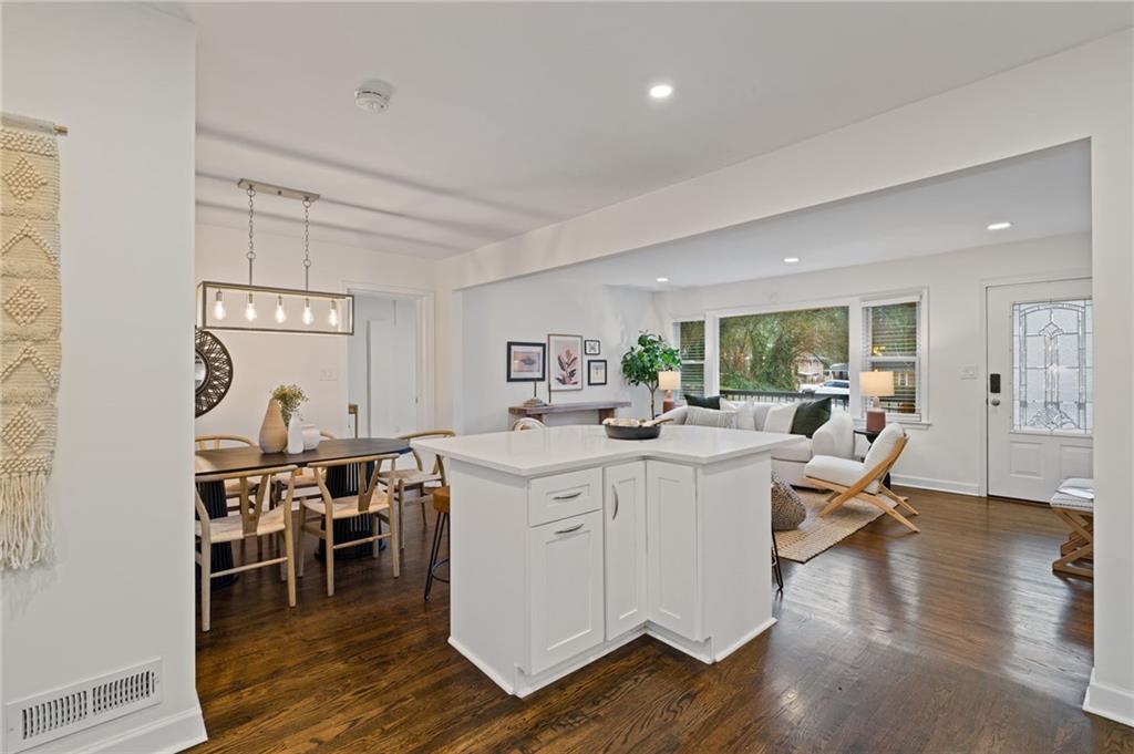 2226 Alpha Drive Decatur, GA 30032 - Photo 7 of 36 a living room with furniture a wooden floor and a large window