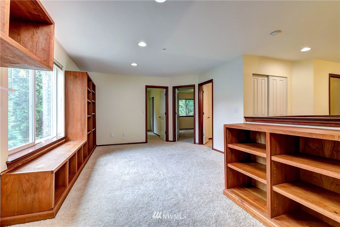 1031 215th Place Southeast Bothell, WA 98021 - Photo 15 of 25 a view of room with furniture and windows