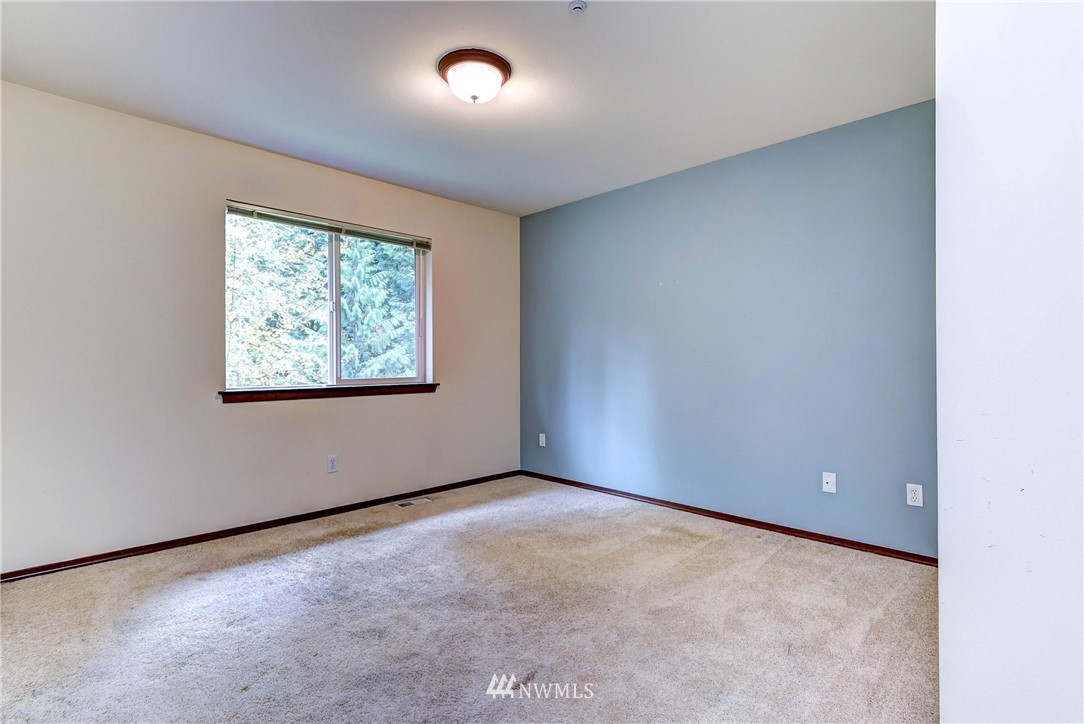 1031 215th Place Southeast Bothell, WA 98021 - Photo 21 of 25 an empty room with windows