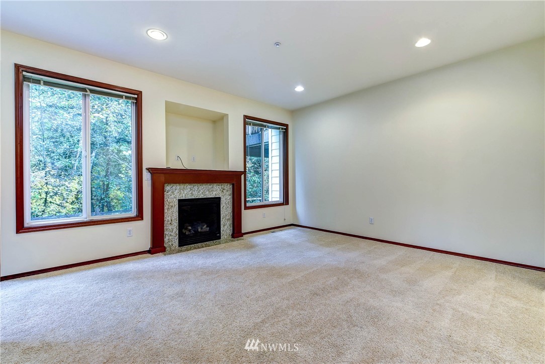 1031 215th Place Southeast Bothell, WA 98021 - Photo 8 of 25 a view of a windows and fireplace in an empty room