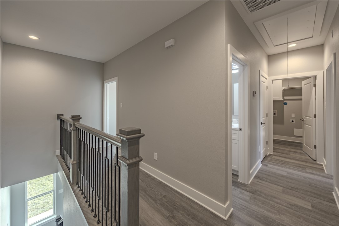 729 Ebenezer Lane Brenham, TX 77833 - Photo 14 of 25 a view of a hallway with wooden floor