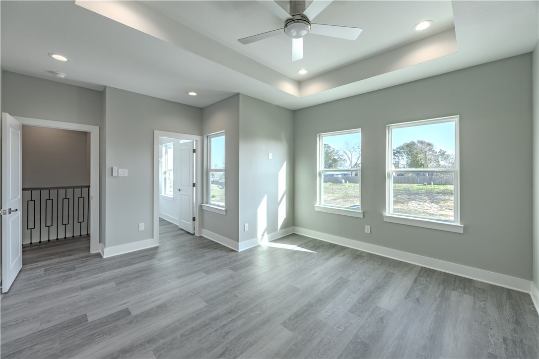 729 Ebenezer Lane Brenham, TX 77833 - Photo 15 of 25 a view of an empty room with wooden floor and a window