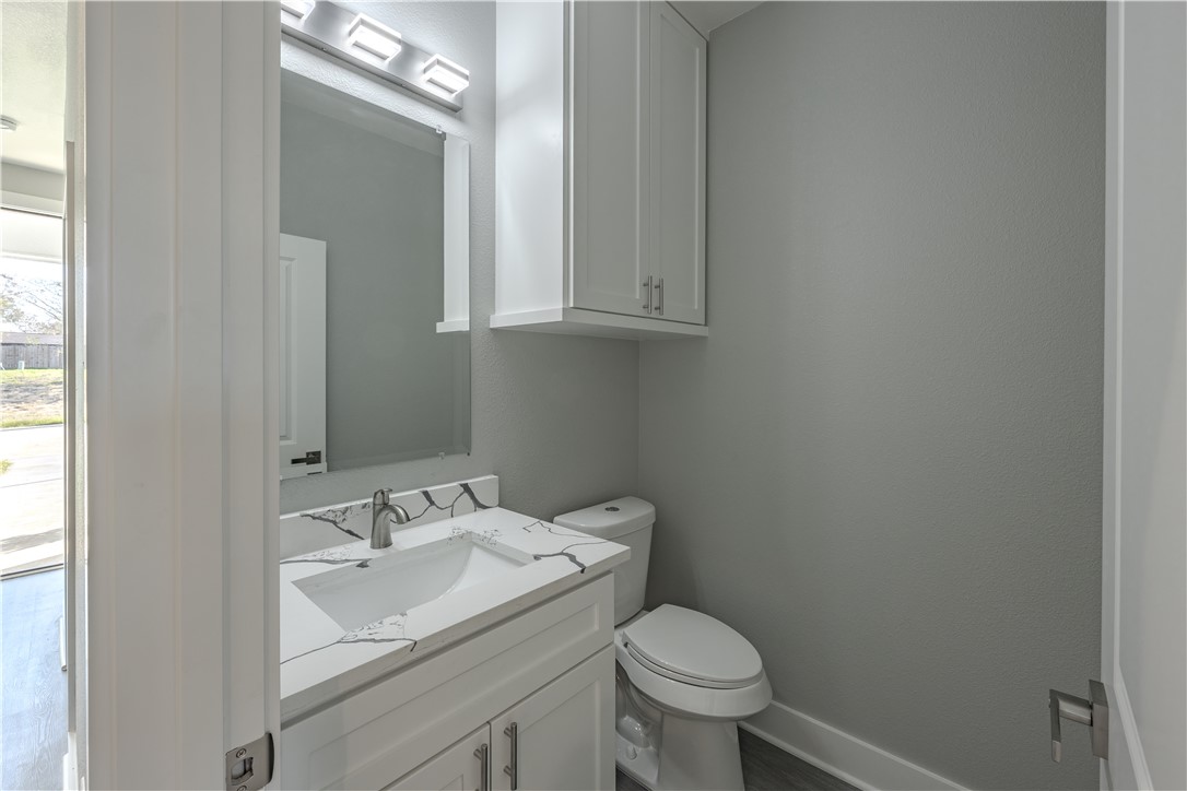729 Ebenezer Lane Brenham, TX 77833 - Photo 7 of 25 a bathroom with a sink and a toilet