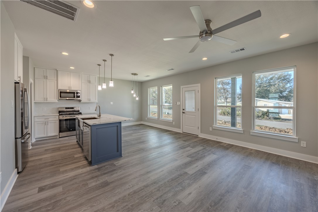 729 Ebenezer Lane Brenham, TX 77833 - Photo 9 of 25 a view of kitchen with window and stainless steel appliances