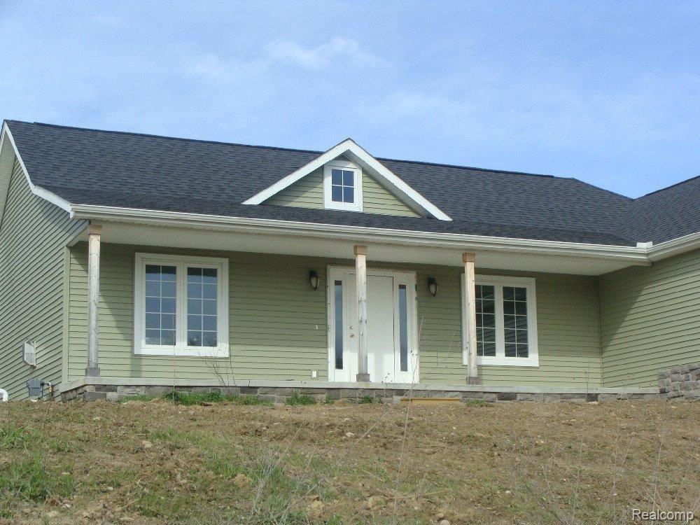 1416 Pebble Creek Road Metamora, MI 48455 - Photo 7 of 18 covered front porch