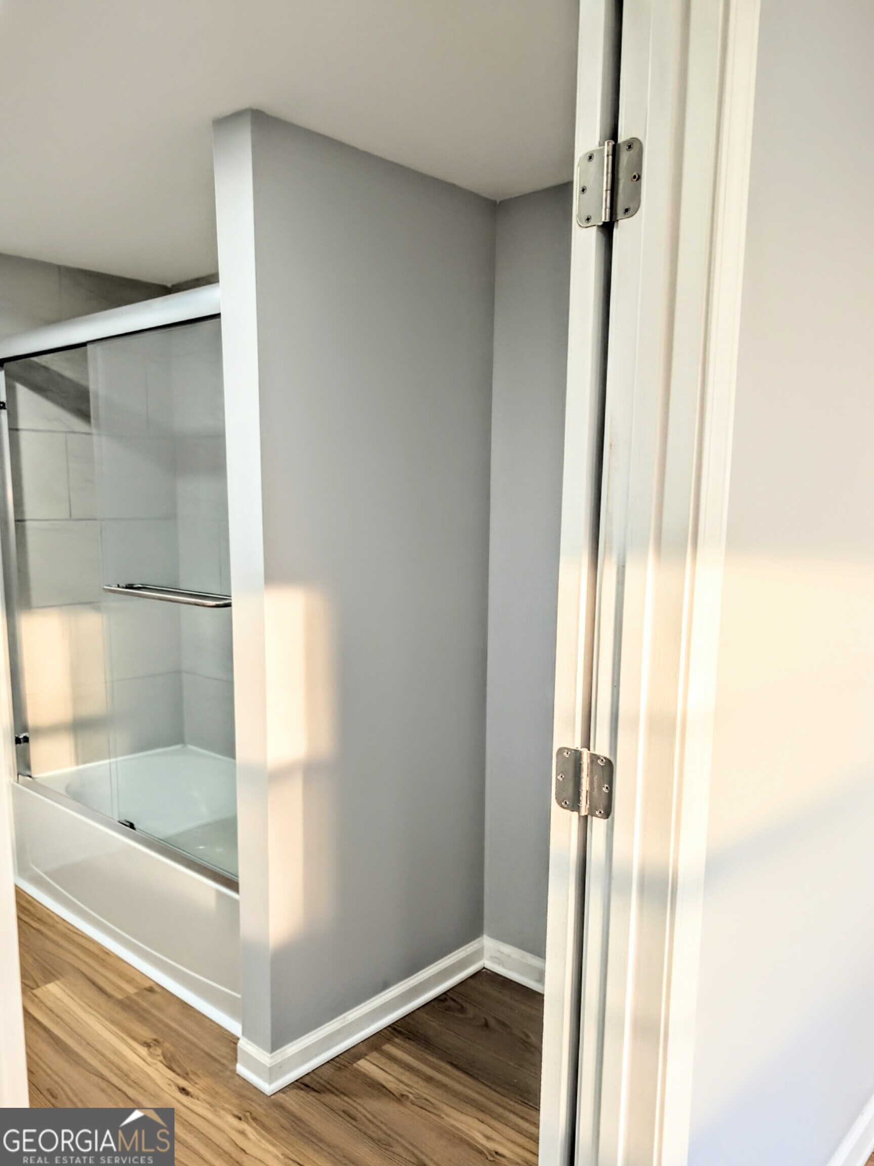 481 West Currahee Street Toccoa, GA 30577 - Photo 17 of 26 a bathroom with a glass shower door