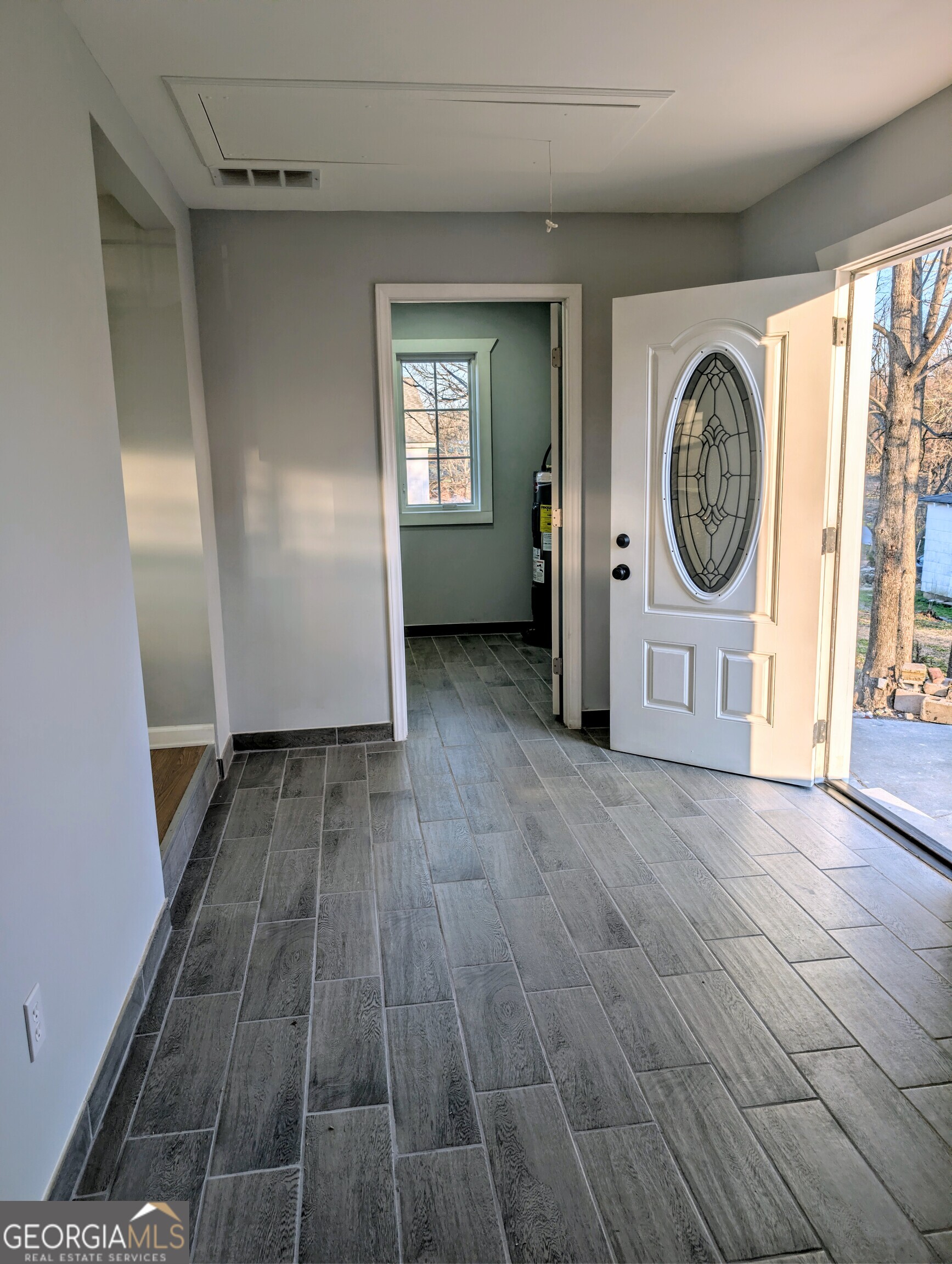 481 West Currahee Street Toccoa, GA 30577 - Photo 19 of 26 a view of a room with wooden floor and window