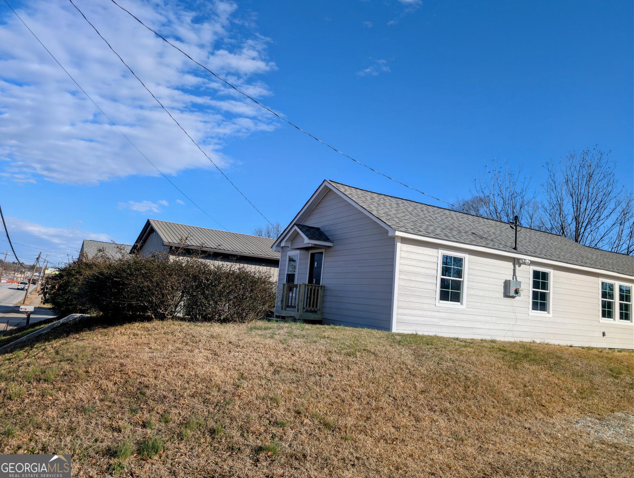 481 West Currahee Street Toccoa, GA 30577 - Photo 2 of 26 a view of a house with a yard