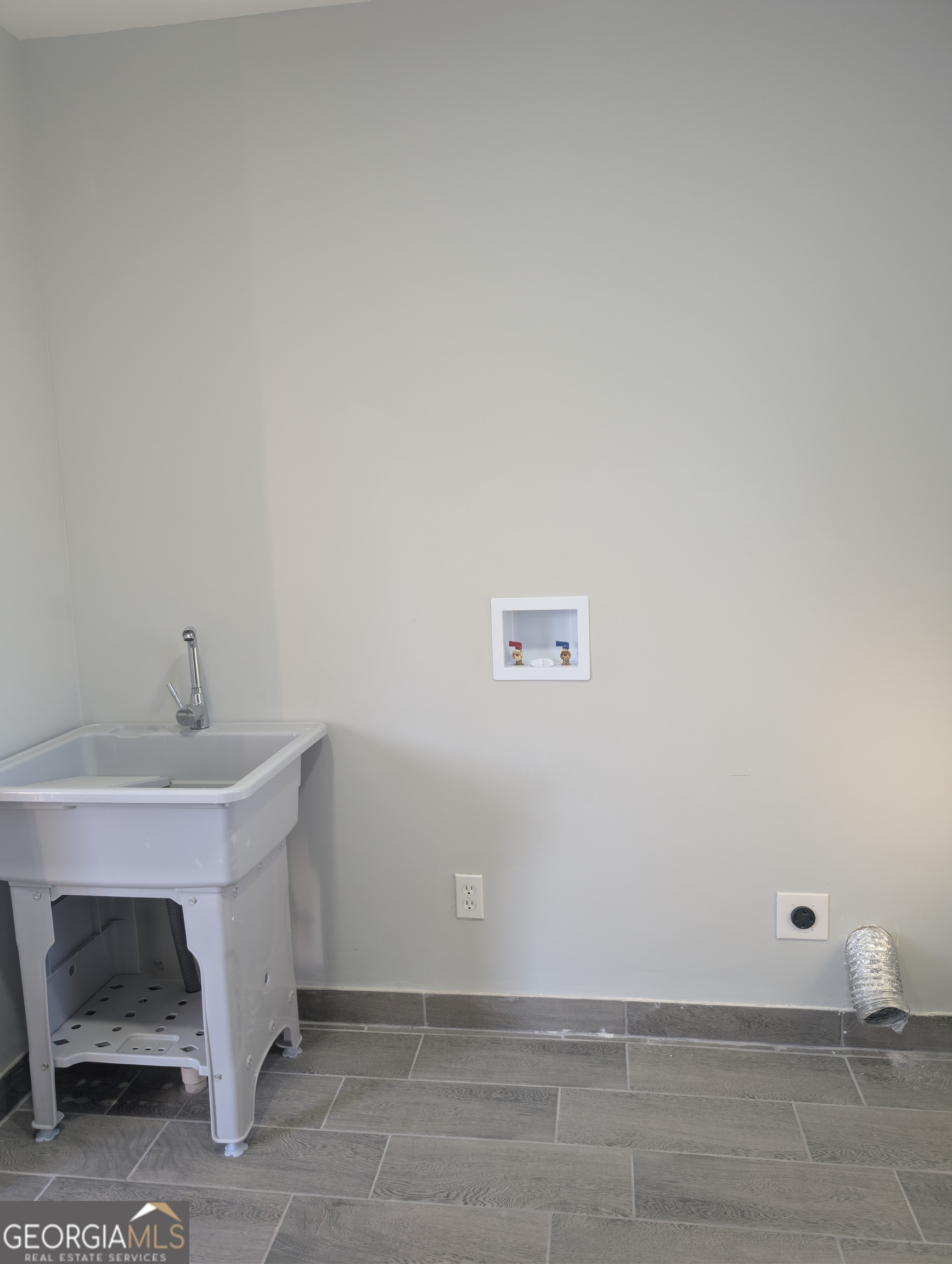 481 West Currahee Street Toccoa, GA 30577 - Photo 23 of 26 a bathroom with a sink and a window