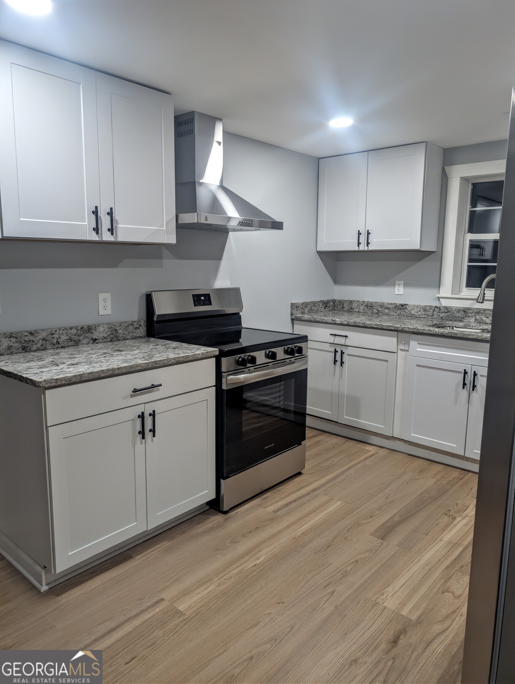 481 West Currahee Street Toccoa, GA 30577 - Photo 7 of 26 a kitchen with granite countertop cabinets stainless steel appliances and a sink