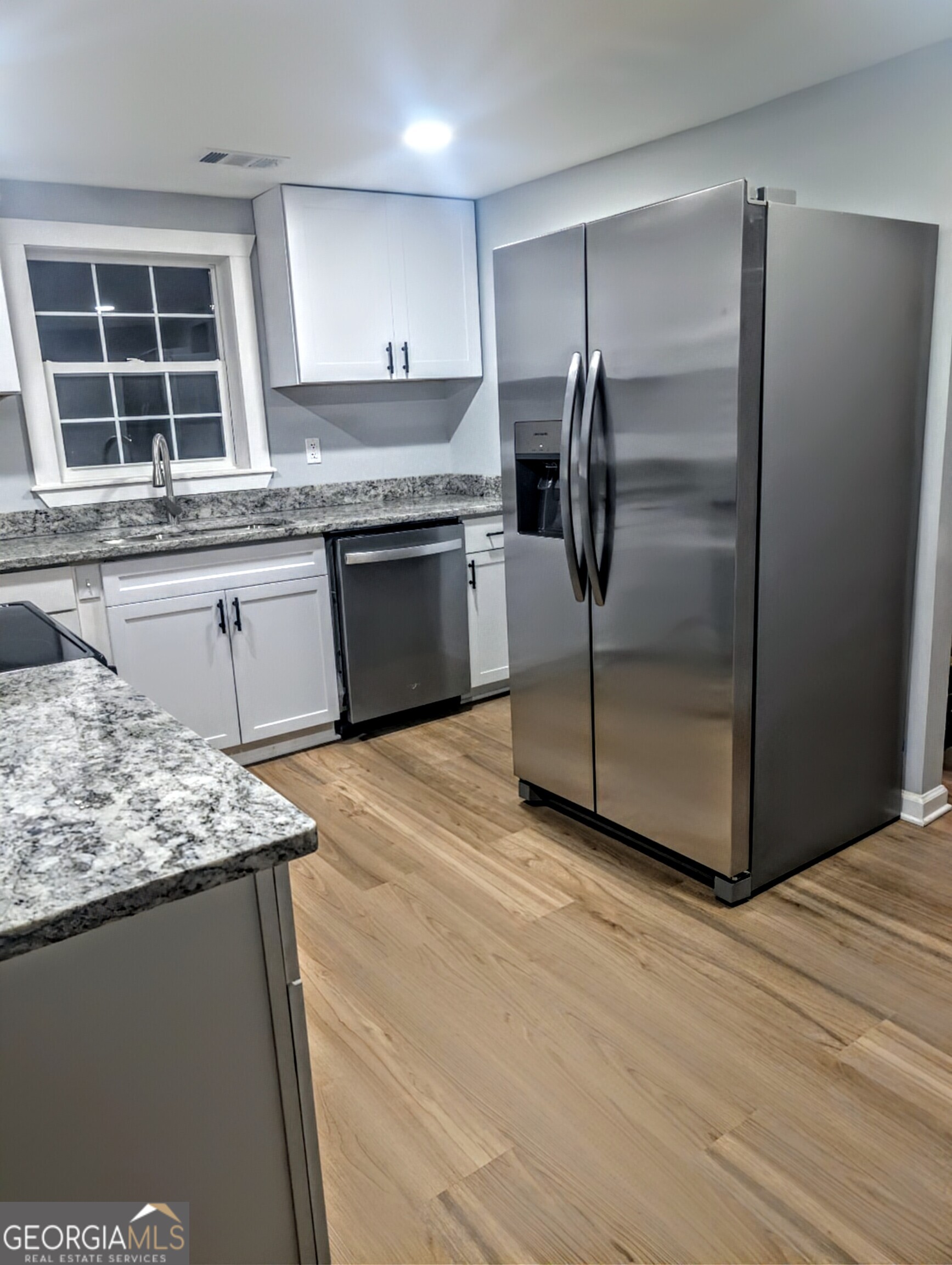 481 West Currahee Street Toccoa, GA 30577 - Photo 9 of 26 a kitchen with stainless steel appliances granite countertop a refrigerator sink and cabinets