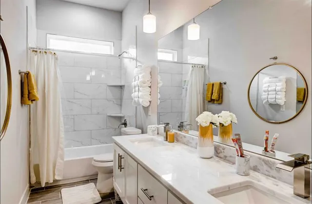 a bathroom with a sink a toilet and a shower