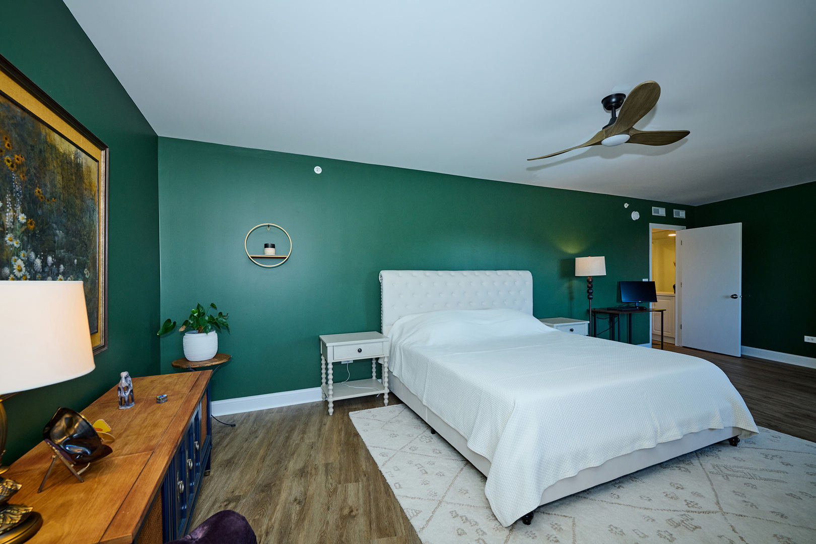 740 Creekside Drive, Unit 510 Mount Prospect, IL 60056 - Photo 20 of 48 a bedroom with a bed and a chandelier