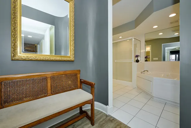a bathroom with a sink a mirror and a bathtub