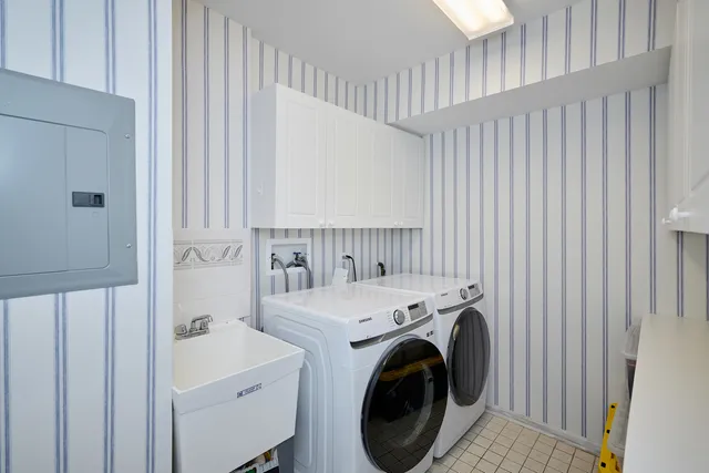 a view of storage and utility room with washer and dryer