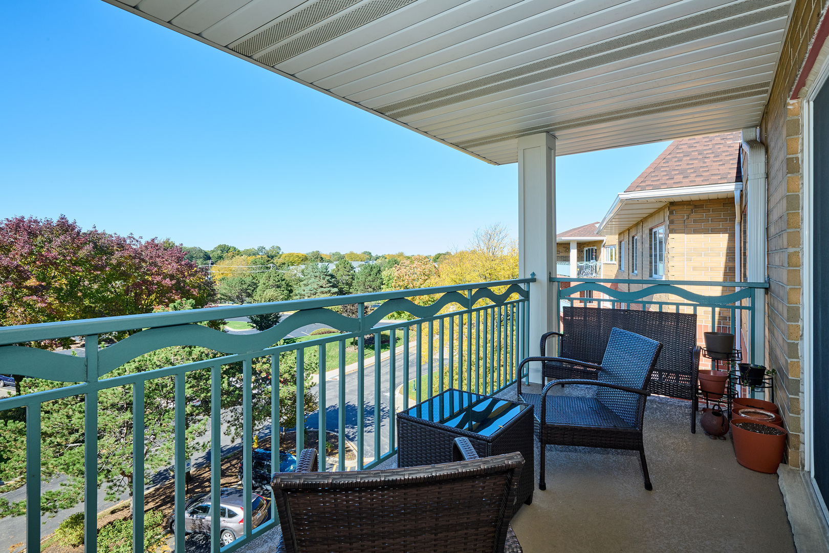 740 Creekside Drive, Unit 510 Mount Prospect, IL 60056 - Photo 42 of 48 a view of a chair and tables in the balcony