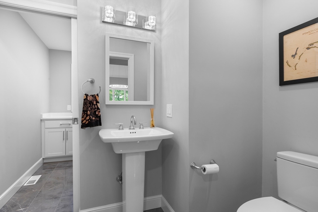 4 The Fairways Ipswich, MA 01938 - Photo 21 of 40 a bathroom with a sink mirror toilet and vanity