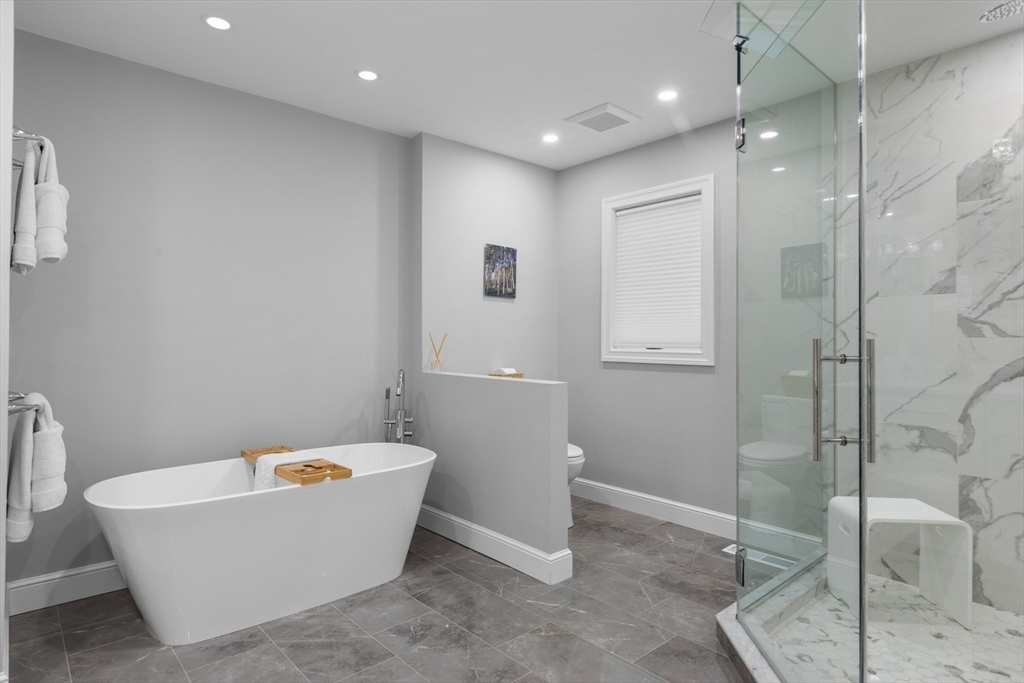 4 The Fairways Ipswich, MA 01938 - Photo 26 of 40 a bathroom with a bathtub and shower