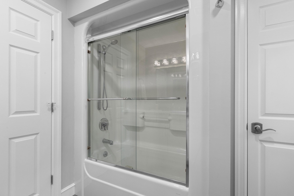 4 The Fairways Ipswich, MA 01938 - Photo 35 of 40 a bathroom with a glass shower door