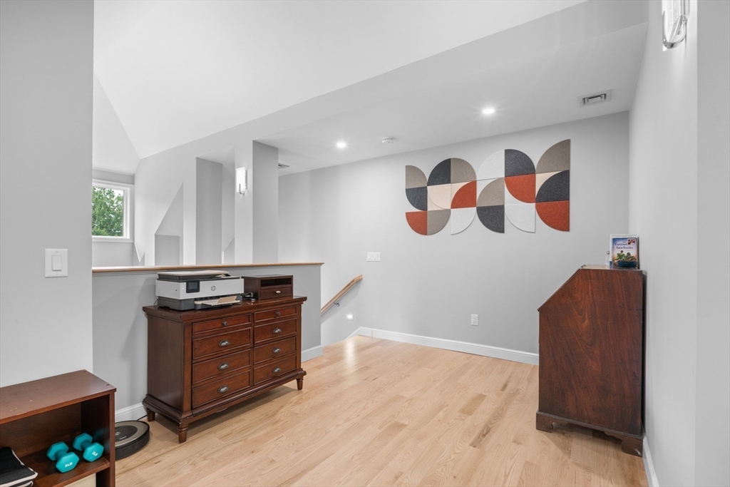 4 The Fairways Ipswich, MA 01938 - Photo 37 of 40 a view of kitchen with stainless steel appliances granite countertop cabinets and wooden floor
