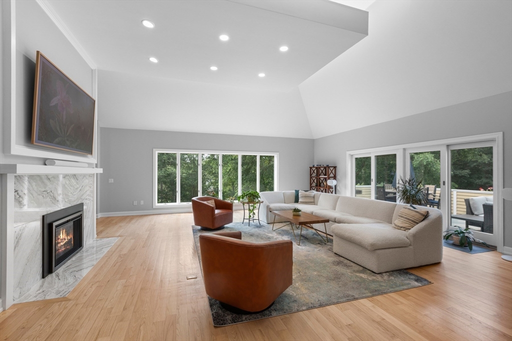 4 The Fairways Ipswich, MA 01938 - Photo 5 of 40 a living room with furniture fireplace and flat screen tv