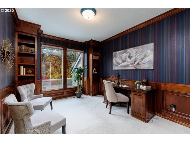 a living room with furniture and large window