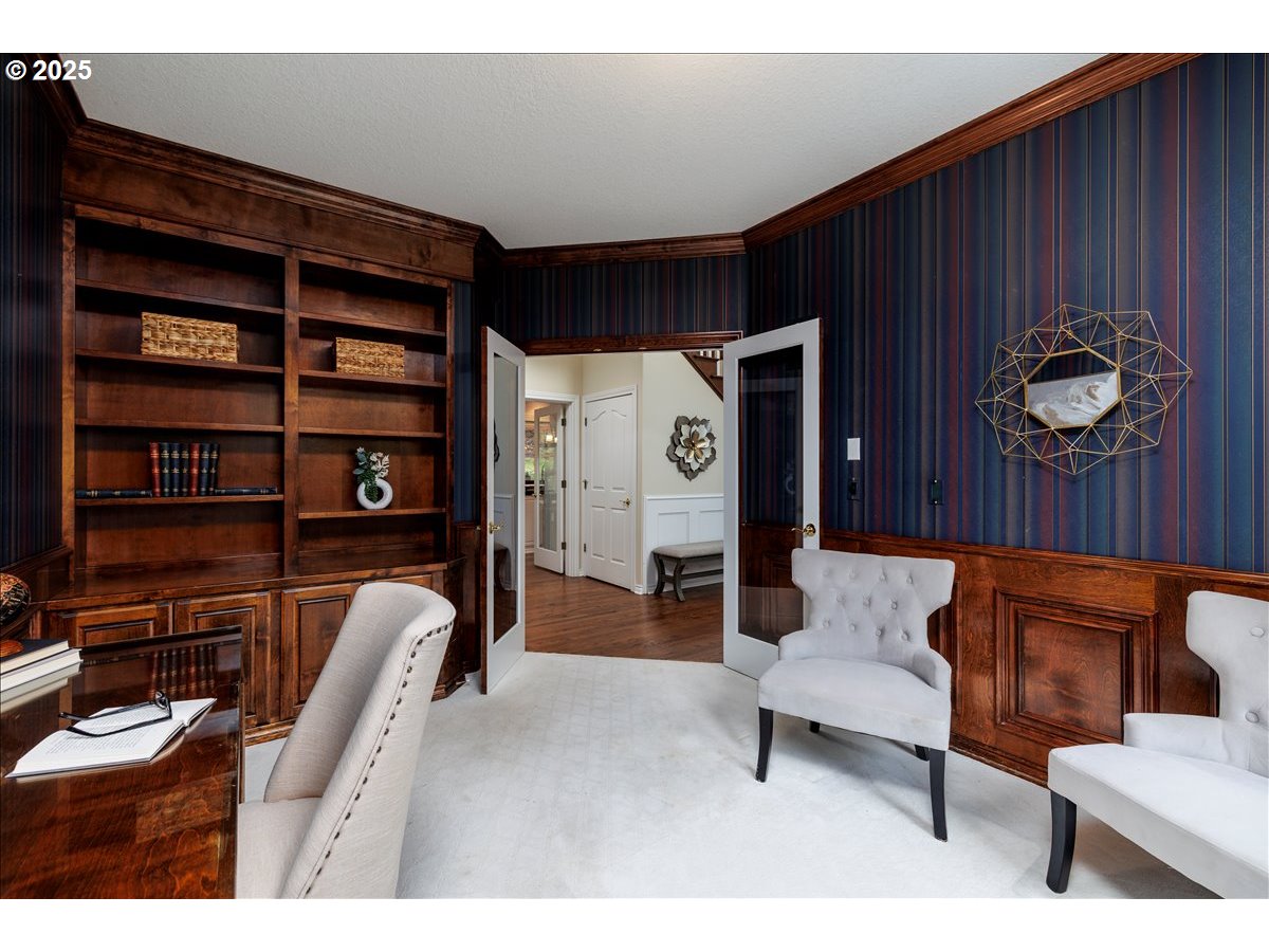 15540 Southwest Baker Lane Portland, OR 97224 - Photo 16 of 43 a living room with furniture and a bookshelf