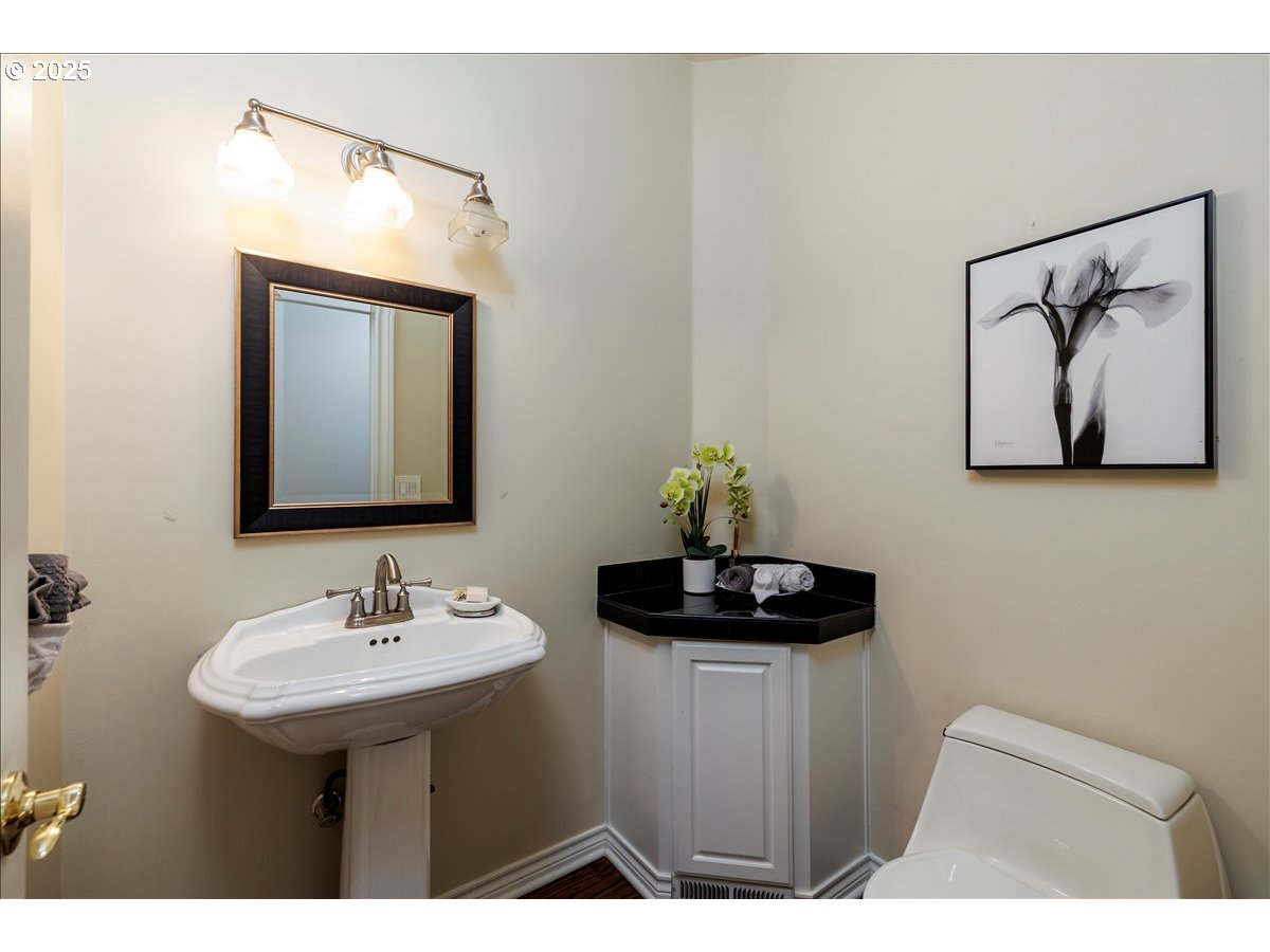 15540 Southwest Baker Lane Portland, OR 97224 - Photo 17 of 43 a bathroom with a sink and a mirror