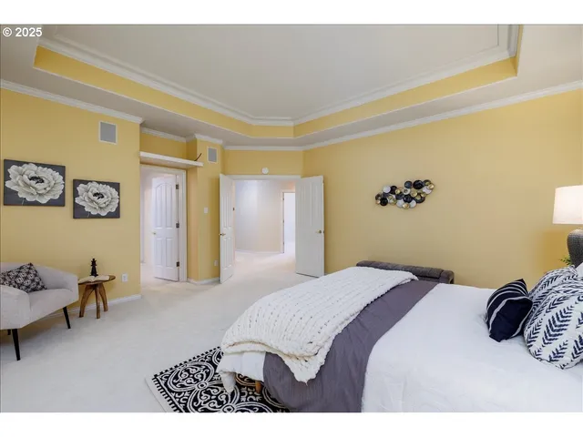 a bedroom with a bed and a couch