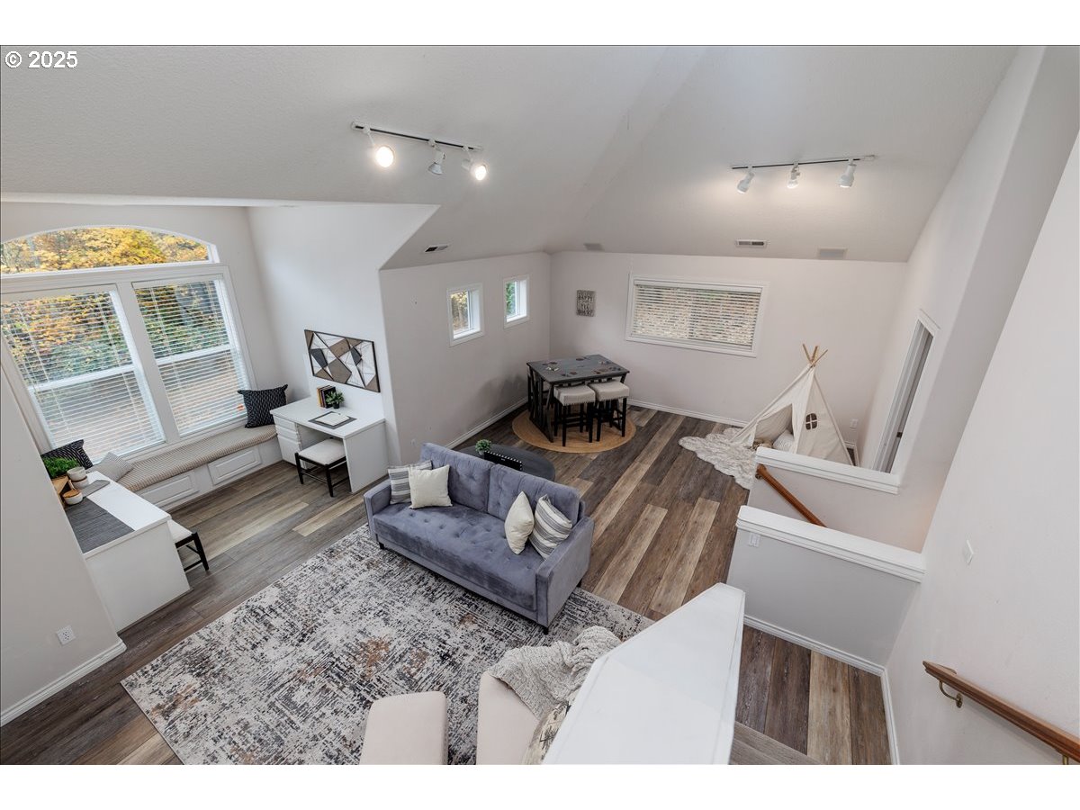 15540 Southwest Baker Lane Portland, OR 97224 - Photo 23 of 43 a living room with furniture and a large window