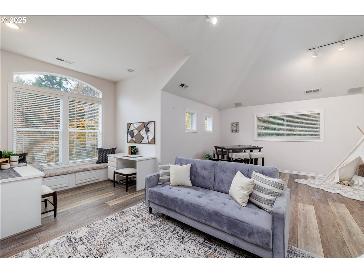 15540 Southwest Baker Lane Portland, OR 97224 - Photo 25 of 43 a living room with furniture and a large window