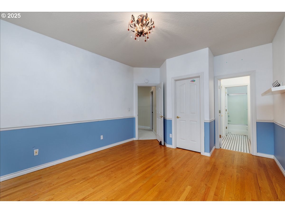 15540 Southwest Baker Lane Portland, OR 97224 - Photo 33 of 43 a view of empty room with wooden floor