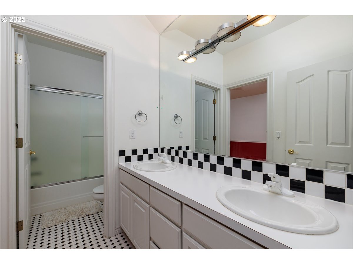 15540 Southwest Baker Lane Portland, OR 97224 - Photo 34 of 43 a bathroom with a sink and a mirror