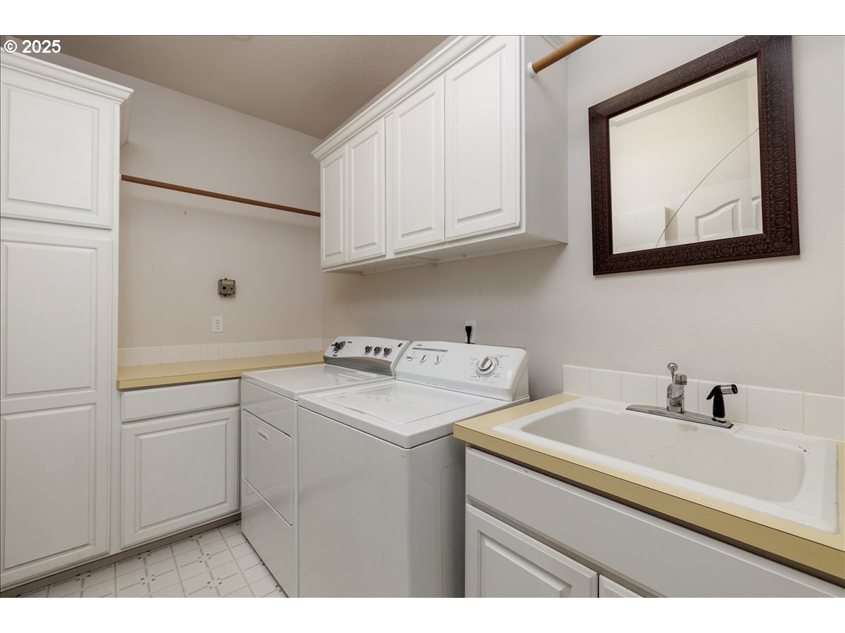 15540 Southwest Baker Lane Portland, OR 97224 - Photo 35 of 43 a bathroom with a sink and a mirror