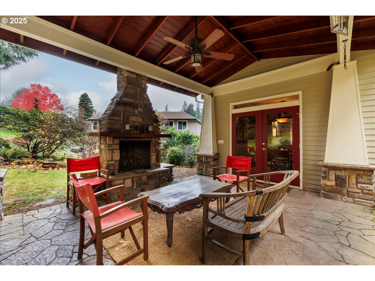 15540 Southwest Baker Lane Portland, OR 97224 - Photo 38 of 43 a outdoor dining space with a stove and a fireplace