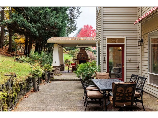 a view of a white house with a outdoor space
