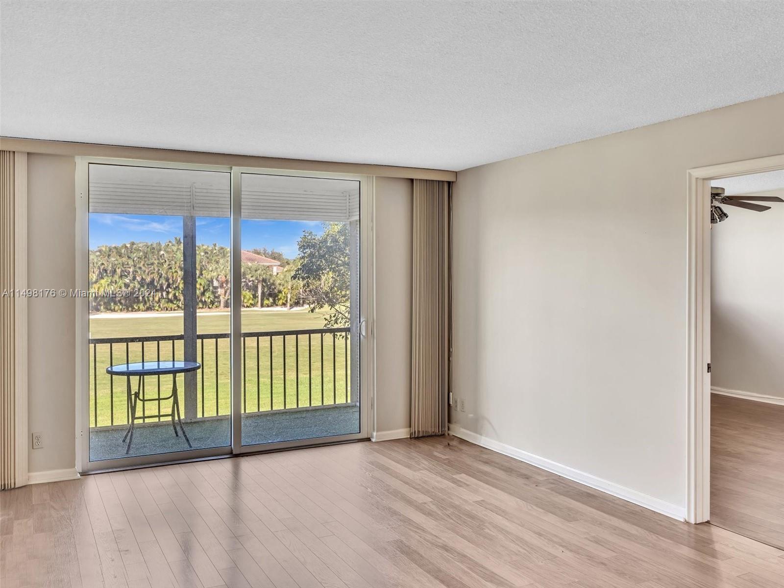 9411 North Hollybrook Lake Drive, Unit 209 Pembroke Pines, FL 33025 - Photo 14 of 36 a view of an empty room with a window