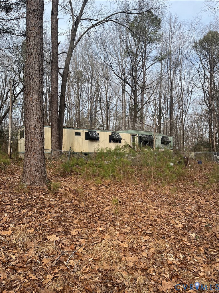 a view of a yard with a tree