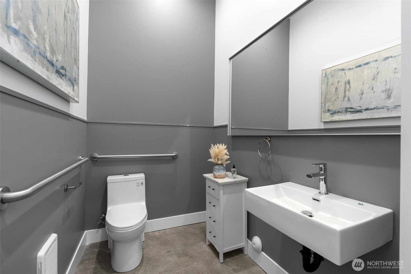 6247 Airport Way South, Unit A Seattle, WA 98108 - Photo 4 of 8 a bathroom with a toilet sink and mirror