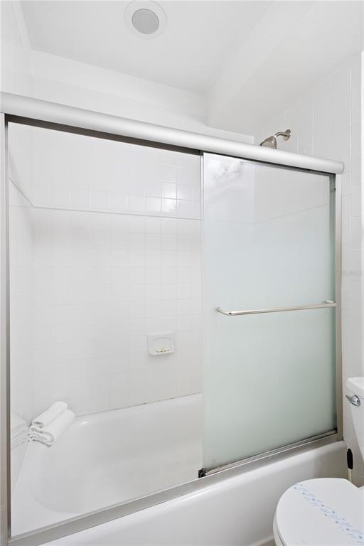 5830 Midnight Pass Road, Unit T22 Sarasota, FL 34242 - Photo 15 of 65 a bathroom with a shower and a toilet