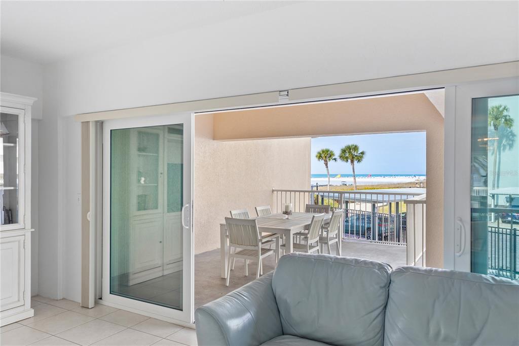 5830 Midnight Pass Road, Unit T22 Sarasota, FL 34242 - Photo 23 of 65 a living room with furniture and a window